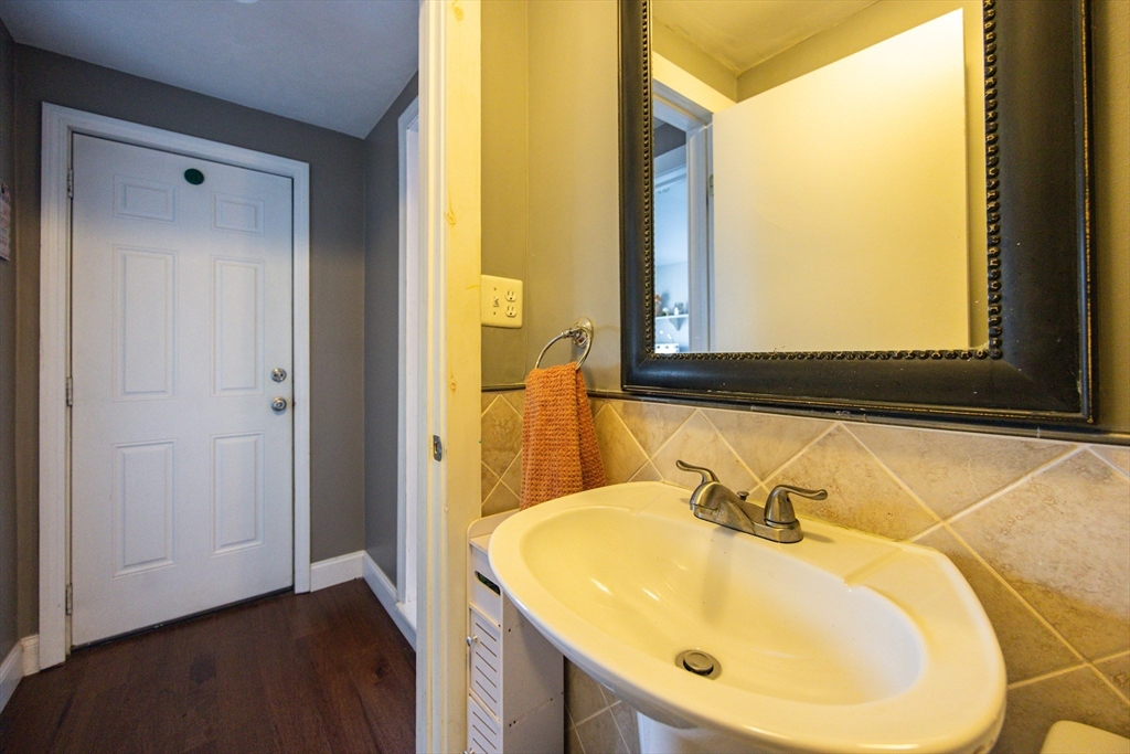 22 Rock Street Acushnet, MA 02743 - Photo 33 of 41 a bathroom with a sink and a mirror