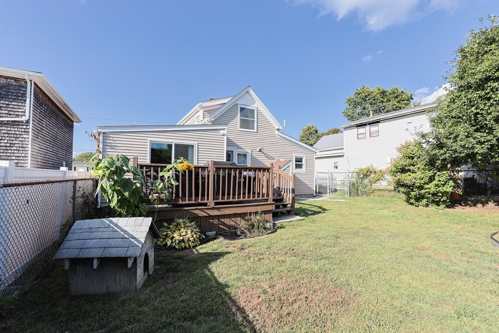 22 Rock Street Acushnet, MA 02743 - Photo 37 of 41 a view of a house with wooden deck and furniture