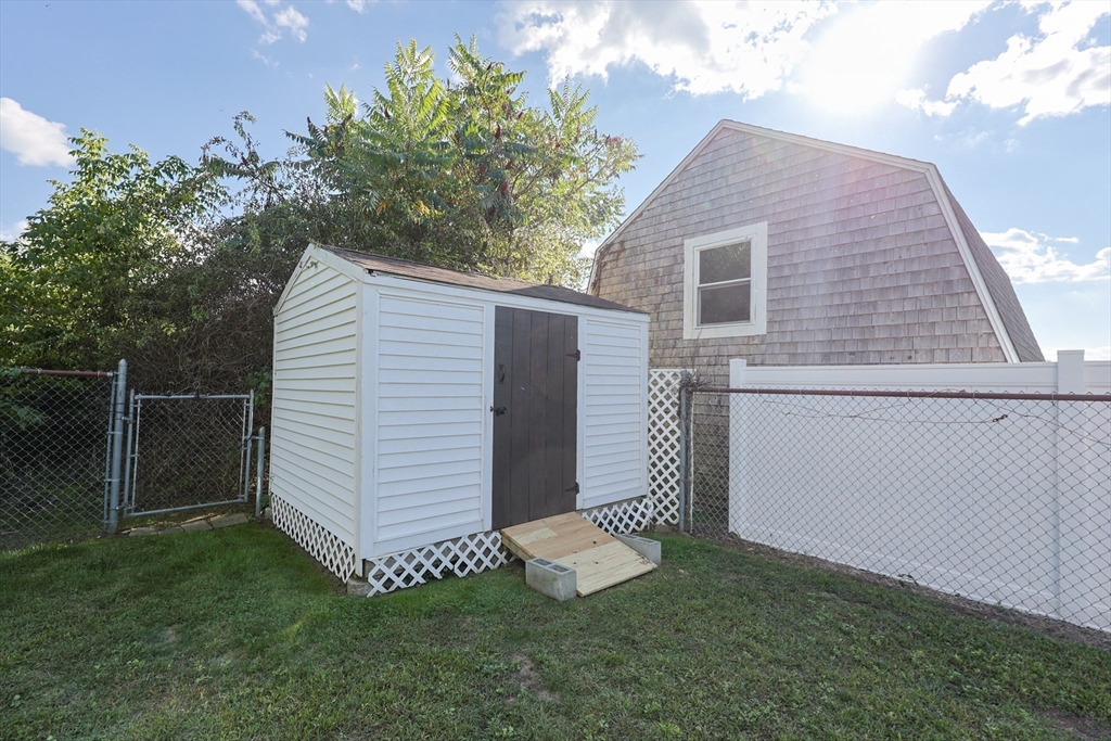 22 Rock Street Acushnet, MA 02743 - Photo 38 of 41 a view of a house with a yard