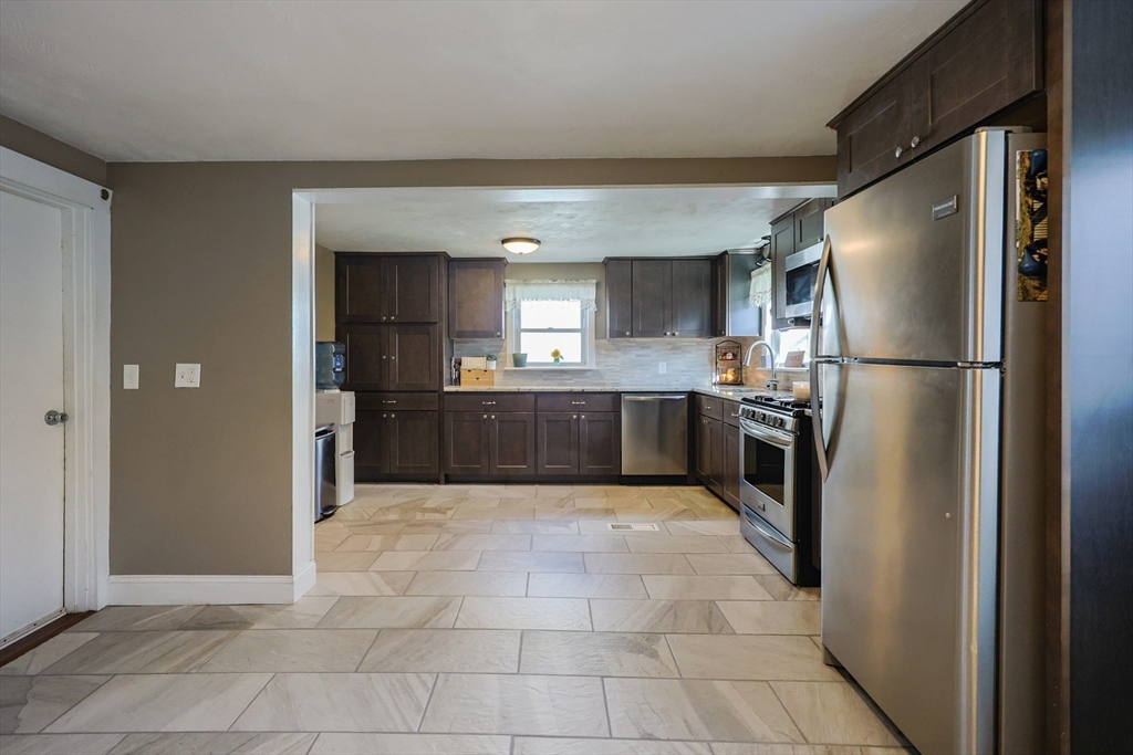 22 Rock Street Acushnet, MA 02743 - Photo 8 of 41 a kitchen with stainless steel appliances granite countertop a refrigerator and a sink