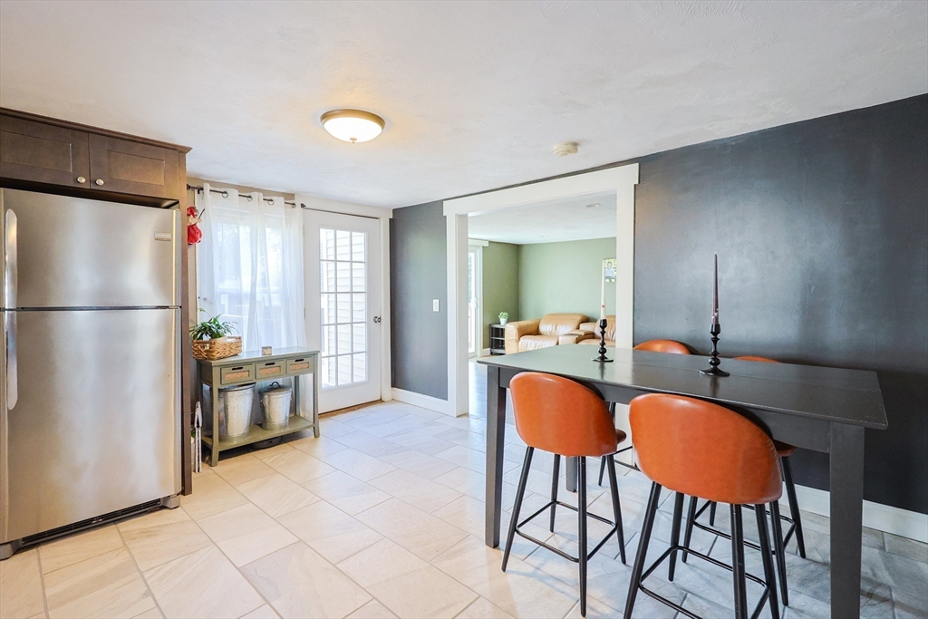 22 Rock Street Acushnet, MA 02743 - Photo 10 of 41 a kitchen with stainless steel appliances granite countertop a refrigerator and a stove top oven
