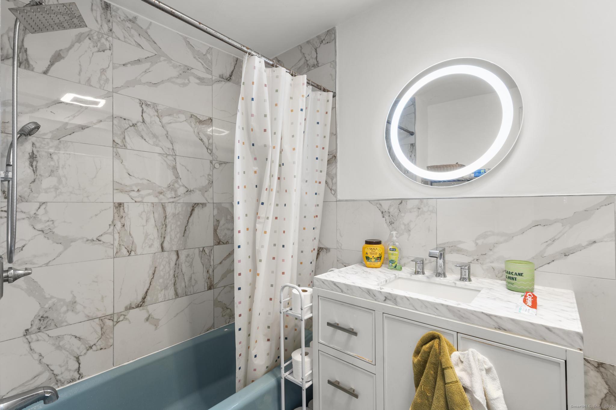 699 Forest Road West Haven, CT 06516 - Photo 11 of 28 a utility room with a sink dryer and washer