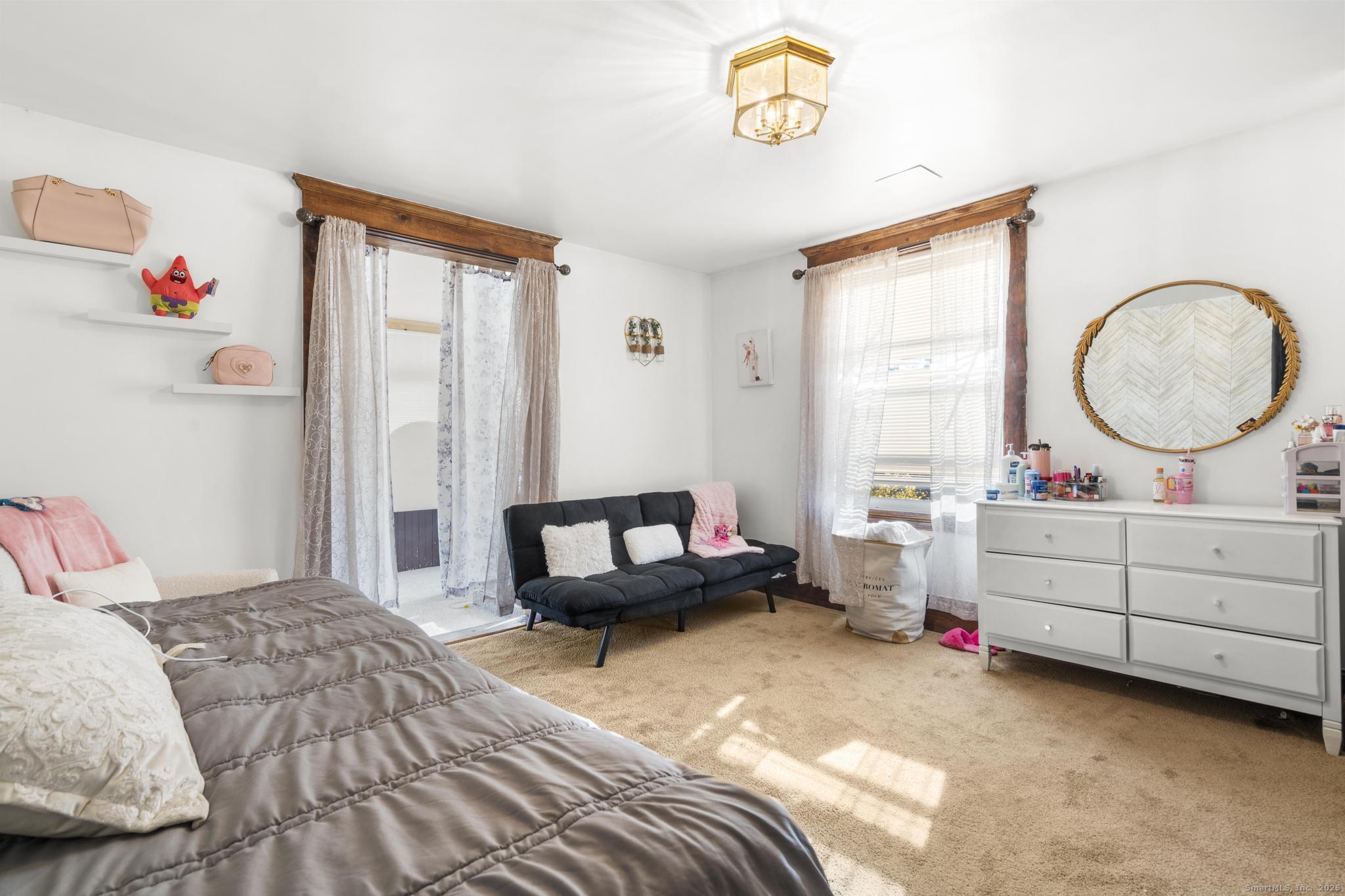 699 Forest Road West Haven, CT 06516 - Photo 13 of 28 a bedroom with a bed and a window