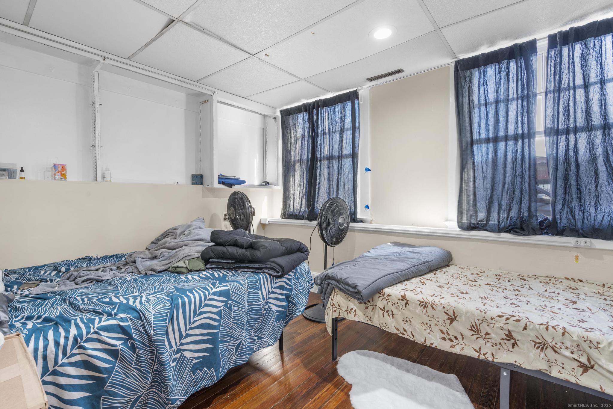 699 Forest Road West Haven, CT 06516 - Photo 14 of 28 a bedroom with a bed and a window