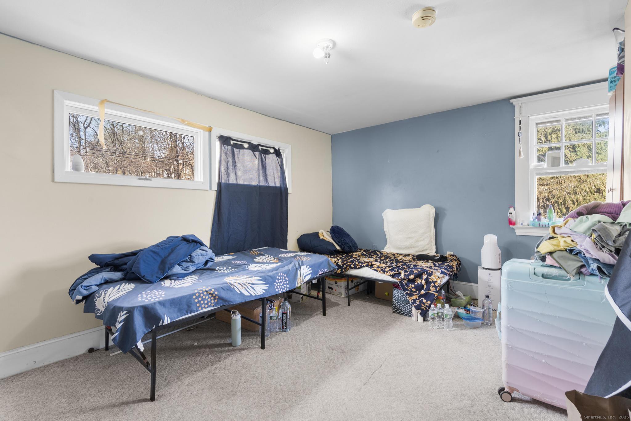 699 Forest Road West Haven, CT 06516 - Photo 19 of 28 a living room with furniture and a window