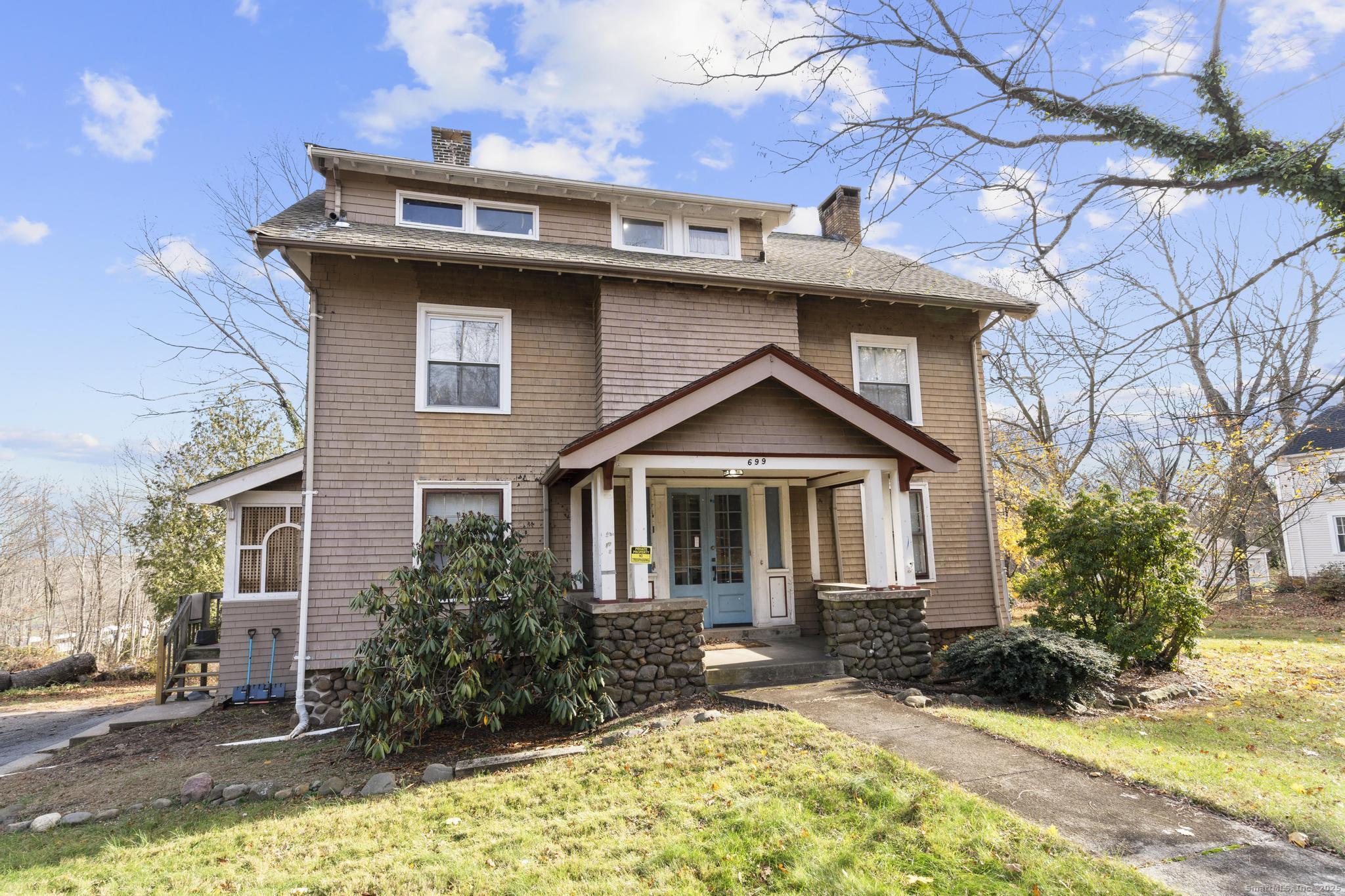 699 Forest Road West Haven, CT 06516 - Photo 2 of 28 a front view of a house with a yard