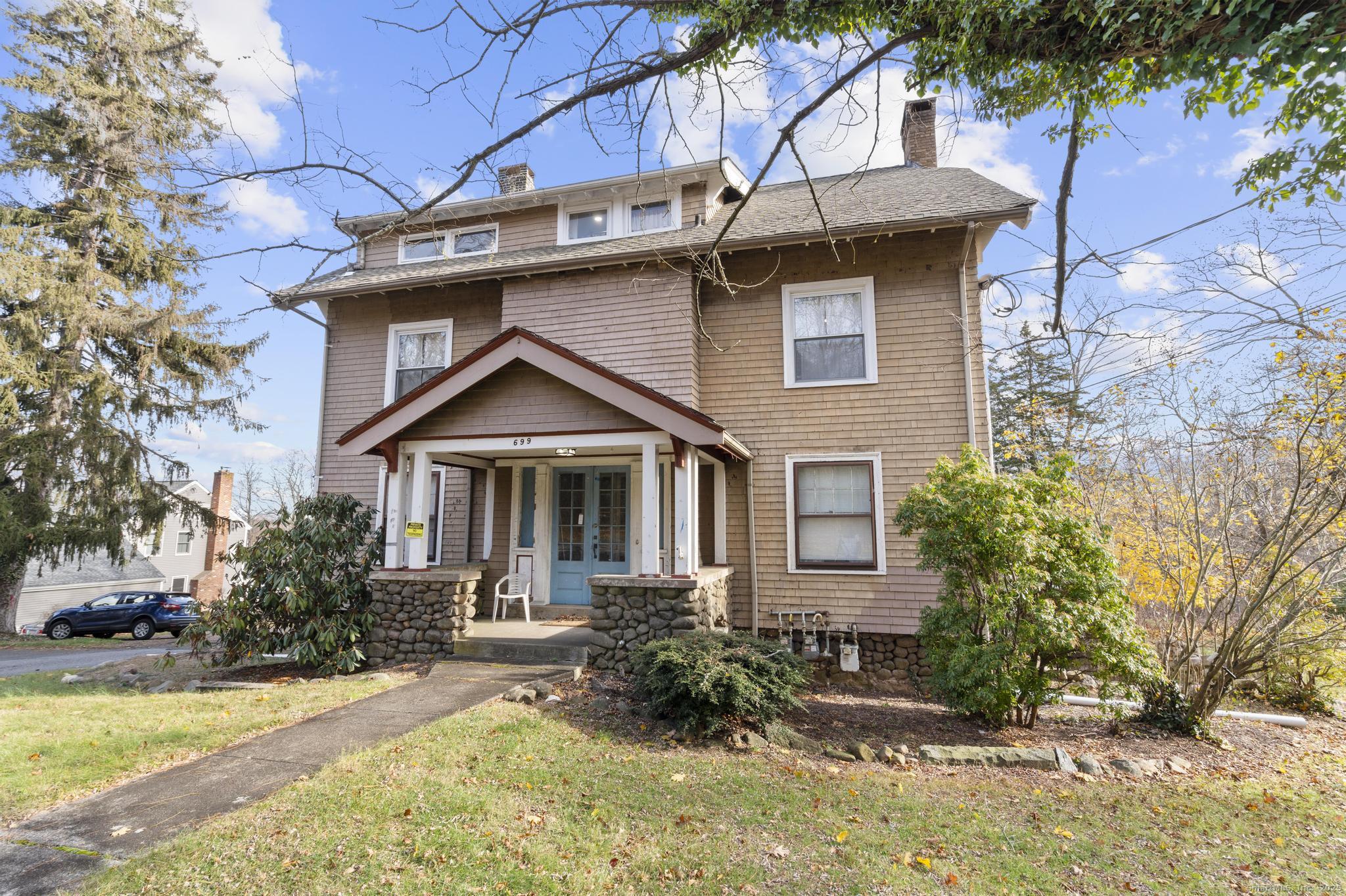 699 Forest Road West Haven, CT 06516 - Photo 3 of 28 a front view of a house with garden