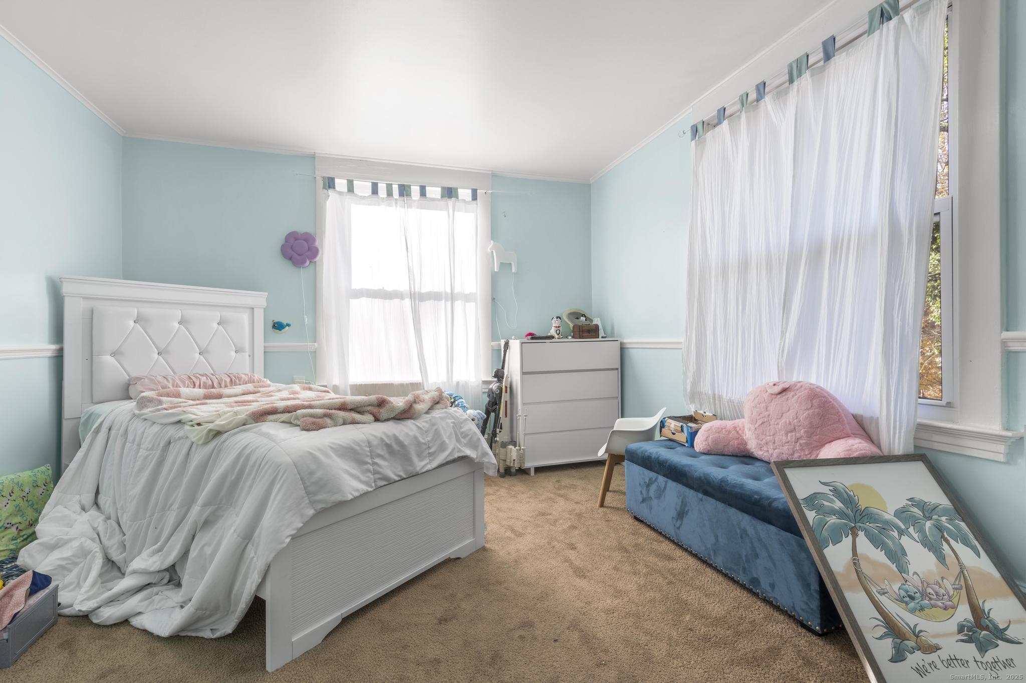 699 Forest Road West Haven, CT 06516 - Photo 10 of 28 a spacious bedroom with a bed and window