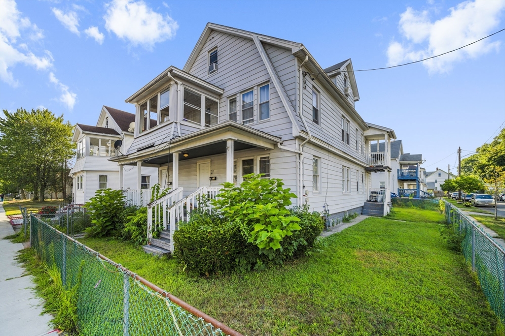 708-710 Carew Street Springfield, MA 01104 - Photo 1 of 38 a front view of house with yard and green space