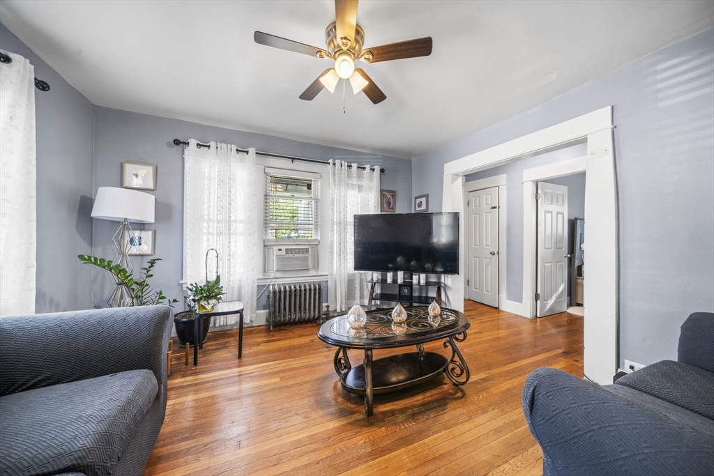 708-710 Carew Street Springfield, MA 01104 - Photo 11 of 38 a living room with furniture and a flat screen tv