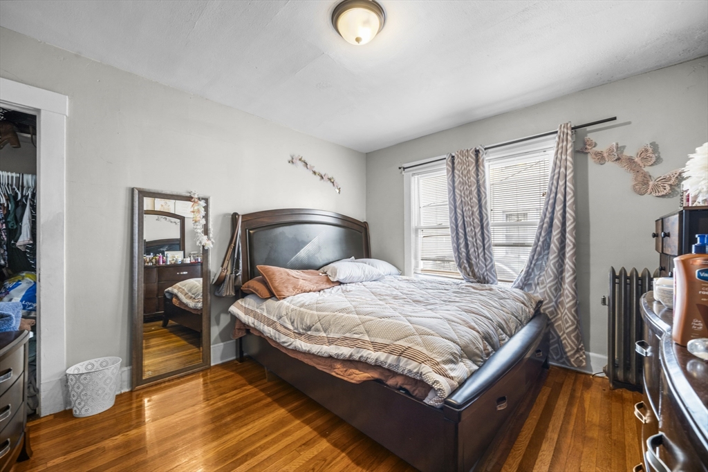 708-710 Carew Street Springfield, MA 01104 - Photo 14 of 38 a bedroom with bed and a window