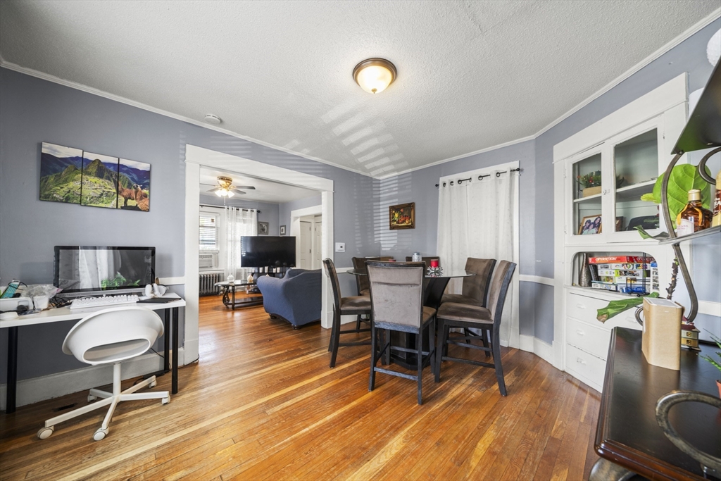 708-710 Carew Street Springfield, MA 01104 - Photo 16 of 38 a living room with furniture and a wooden floor