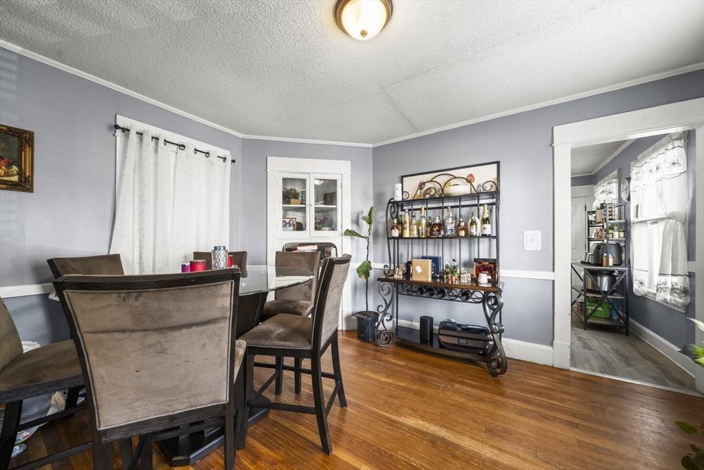 708-710 Carew Street Springfield, MA 01104 - Photo 17 of 38 a view of a workspace with furniture and a livingroom