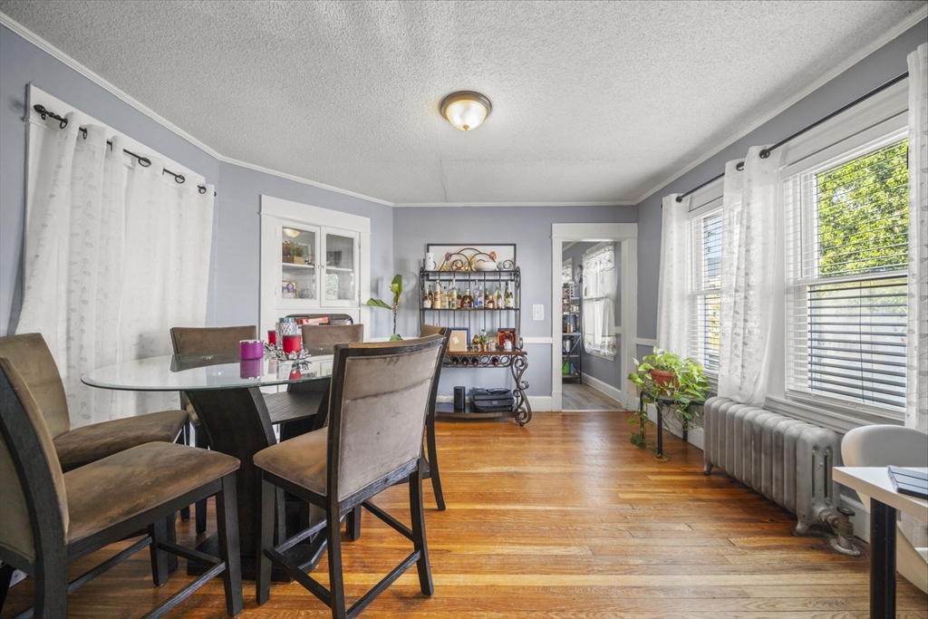708-710 Carew Street Springfield, MA 01104 - Photo 18 of 38 a dining room with furniture and wooden floor