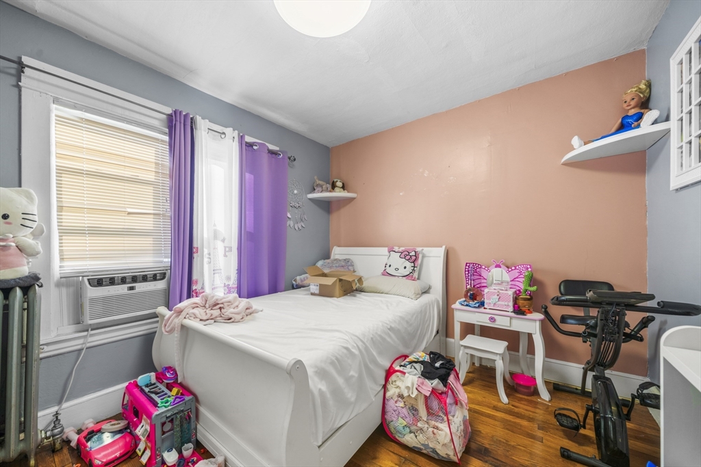 708-710 Carew Street Springfield, MA 01104 - Photo 23 of 38 a bedroom with a bed and a window