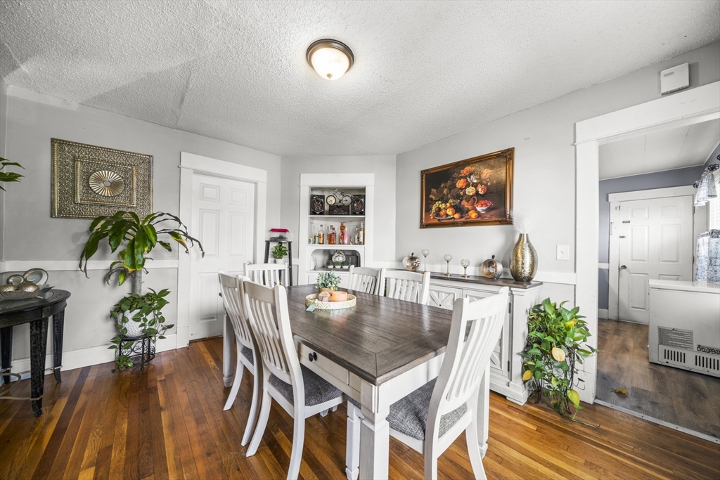 708-710 Carew Street Springfield, MA 01104 - Photo 24 of 38 a view of a dining room with furniture and wooden floor