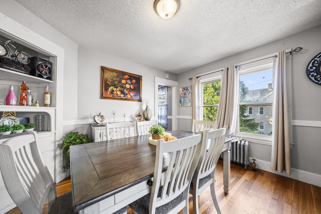 708-710 Carew Street Springfield, MA 01104 - Photo 25 of 38 a living room with furniture and a wooden floor
