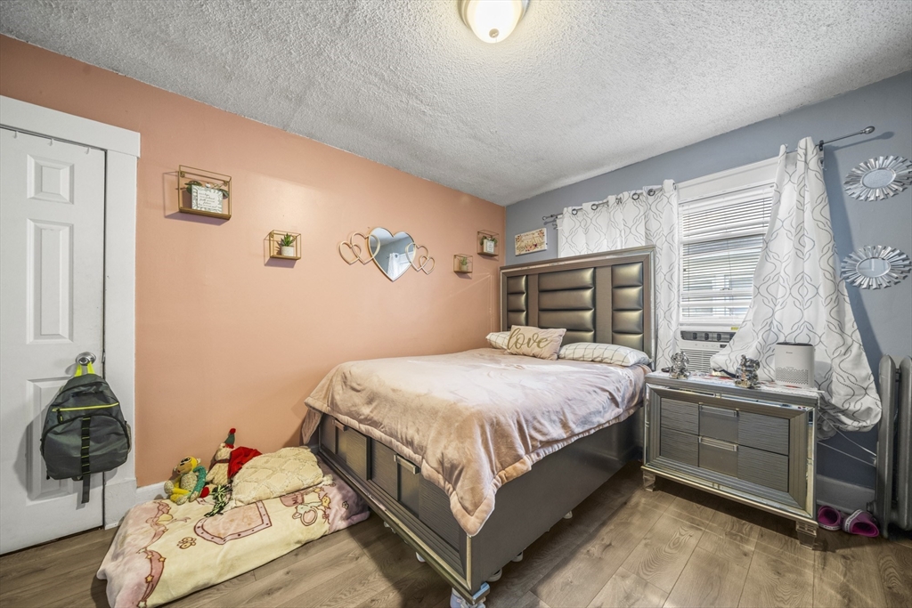 708-710 Carew Street Springfield, MA 01104 - Photo 26 of 38 a bedroom with a bed and a window