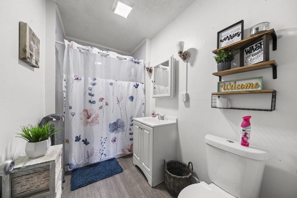 708-710 Carew Street Springfield, MA 01104 - Photo 28 of 38 a bathroom with a sink toilet and shower