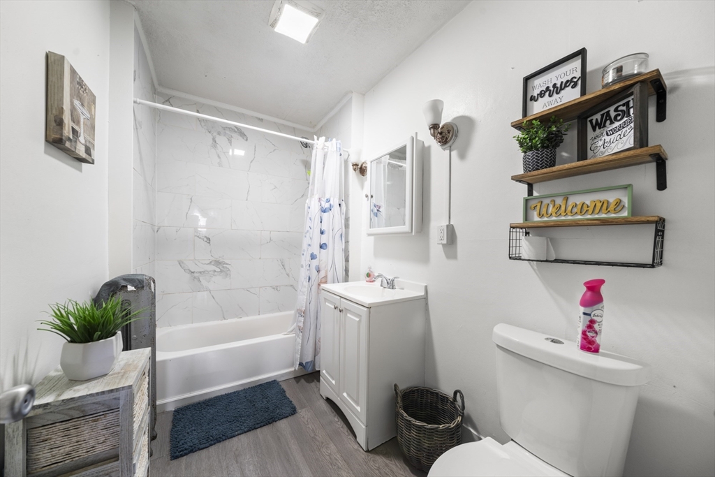 708-710 Carew Street Springfield, MA 01104 - Photo 29 of 38 a bathroom with a sink toilet and shower