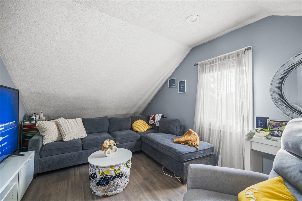 708-710 Carew Street Springfield, MA 01104 - Photo 37 of 38 a living room with furniture and a couch