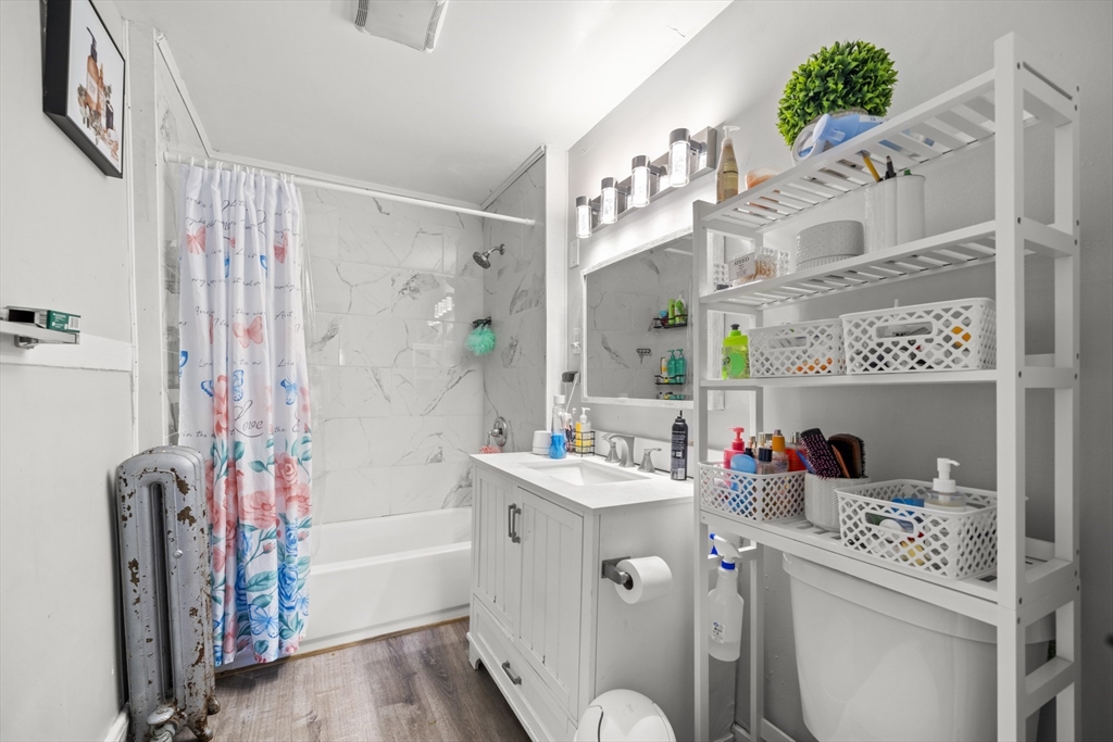 708-710 Carew Street Springfield, MA 01104 - Photo 5 of 38 a bathroom with a sink toilet vanity and shower