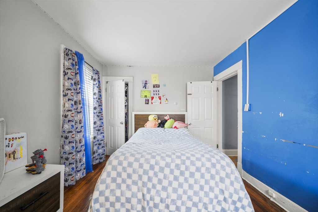 708-710 Carew Street Springfield, MA 01104 - Photo 7 of 38 a bedroom with a bed and a dresser