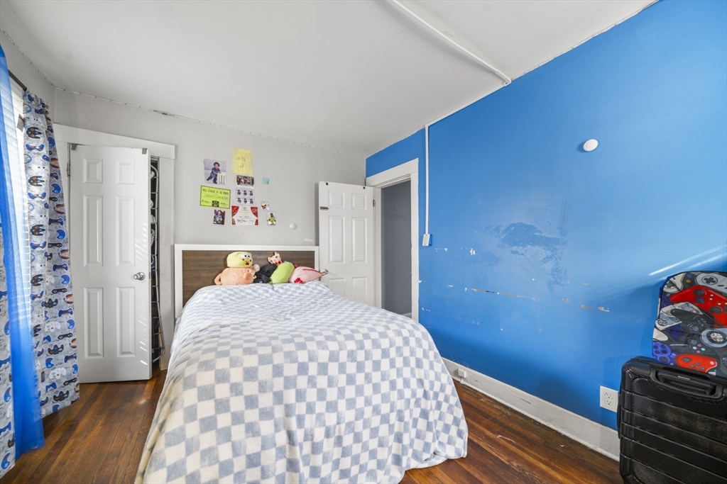 708-710 Carew Street Springfield, MA 01104 - Photo 8 of 38 a bedroom with a bed and a window