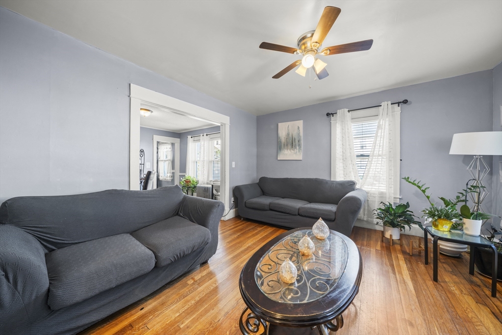 708-710 Carew Street Springfield, MA 01104 - Photo 9 of 38 a living room with furniture and a wooden floor