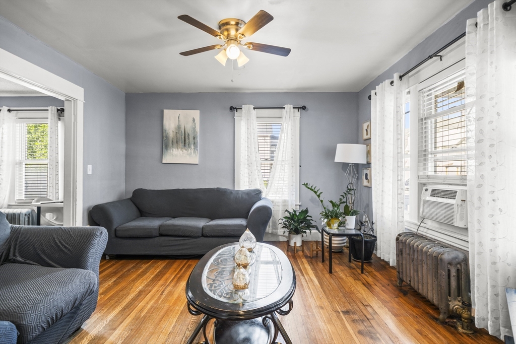 708-710 Carew Street Springfield, MA 01104 - Photo 10 of 38 a living room with furniture and a large window