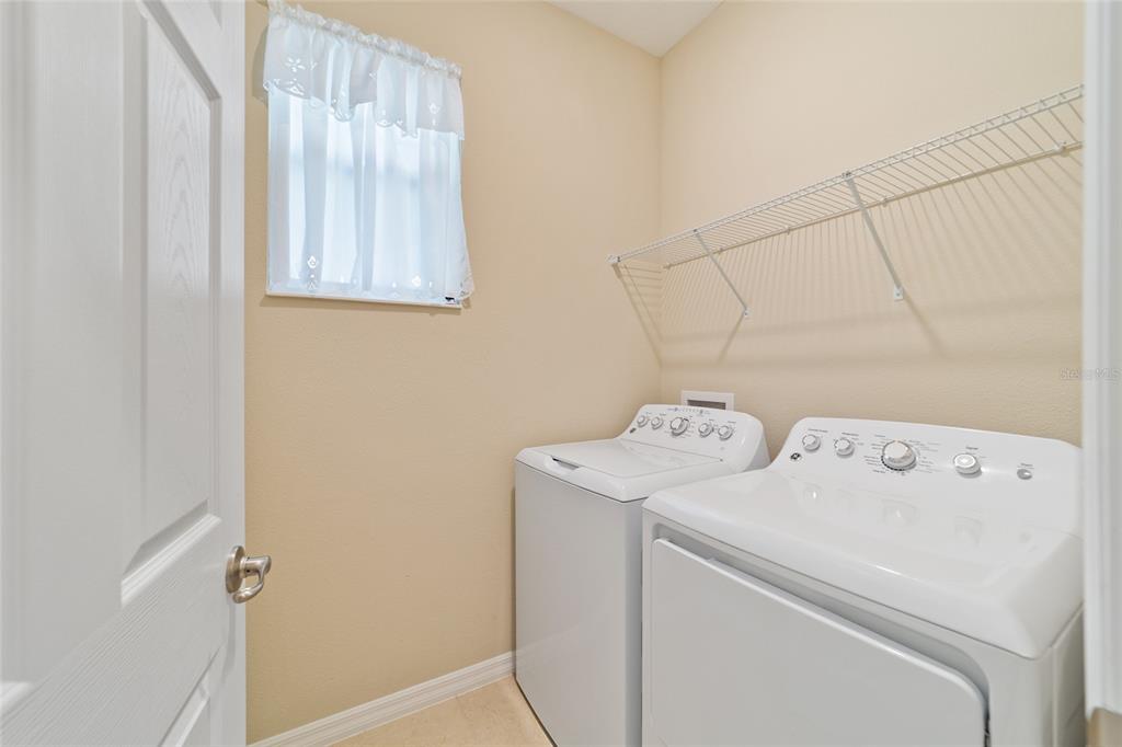 9776 Southwest 100th Avenue Ocala, FL 34481 - Photo 43 of 52 a view of storage and utility room with washer and dryer