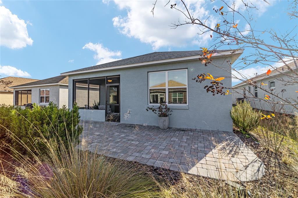 9776 Southwest 100th Avenue Ocala, FL 34481 - Photo 52 of 52 a view of a house with a yard and potted plants