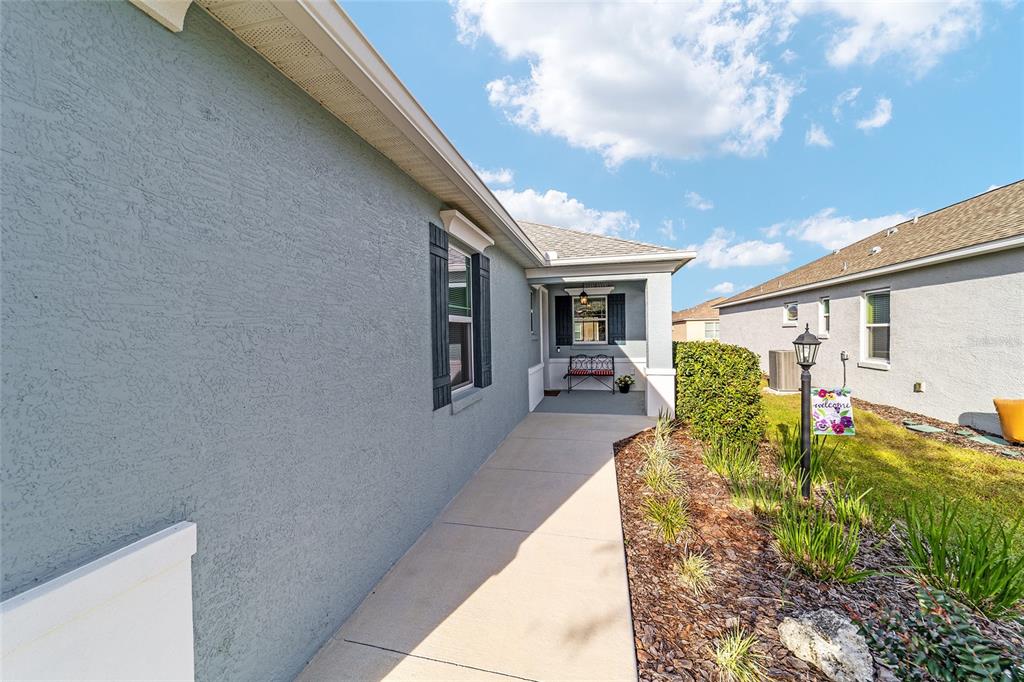 9776 Southwest 100th Avenue Ocala, FL 34481 - Photo 9 of 52 a view of a house with backyard and sitting area