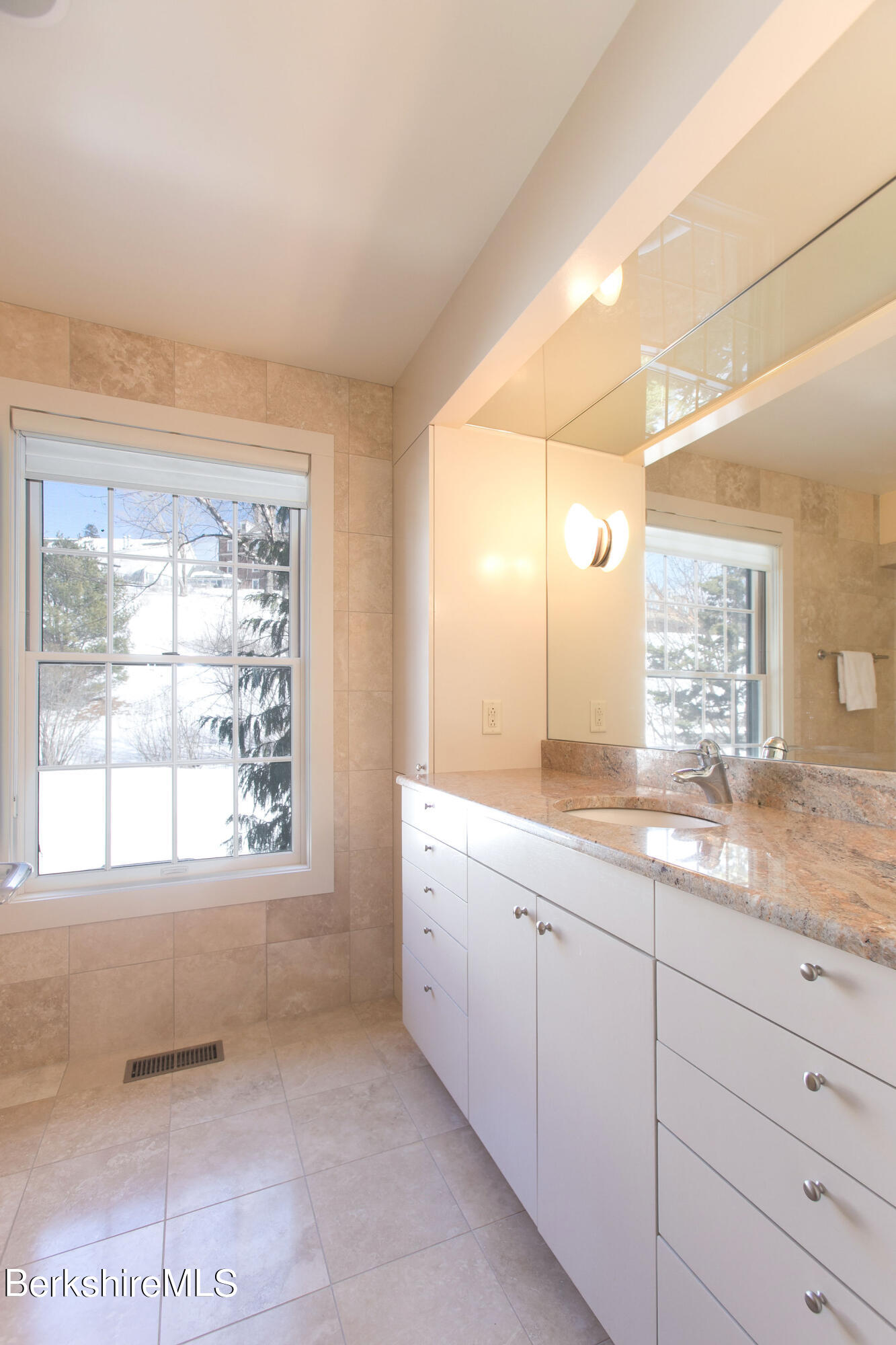 200 Old Stockbridge Road, Unit 3B Lenox, MA 01240 - Photo 14 of 36 a bathroom with a granite countertop sink mirror and a bathtub