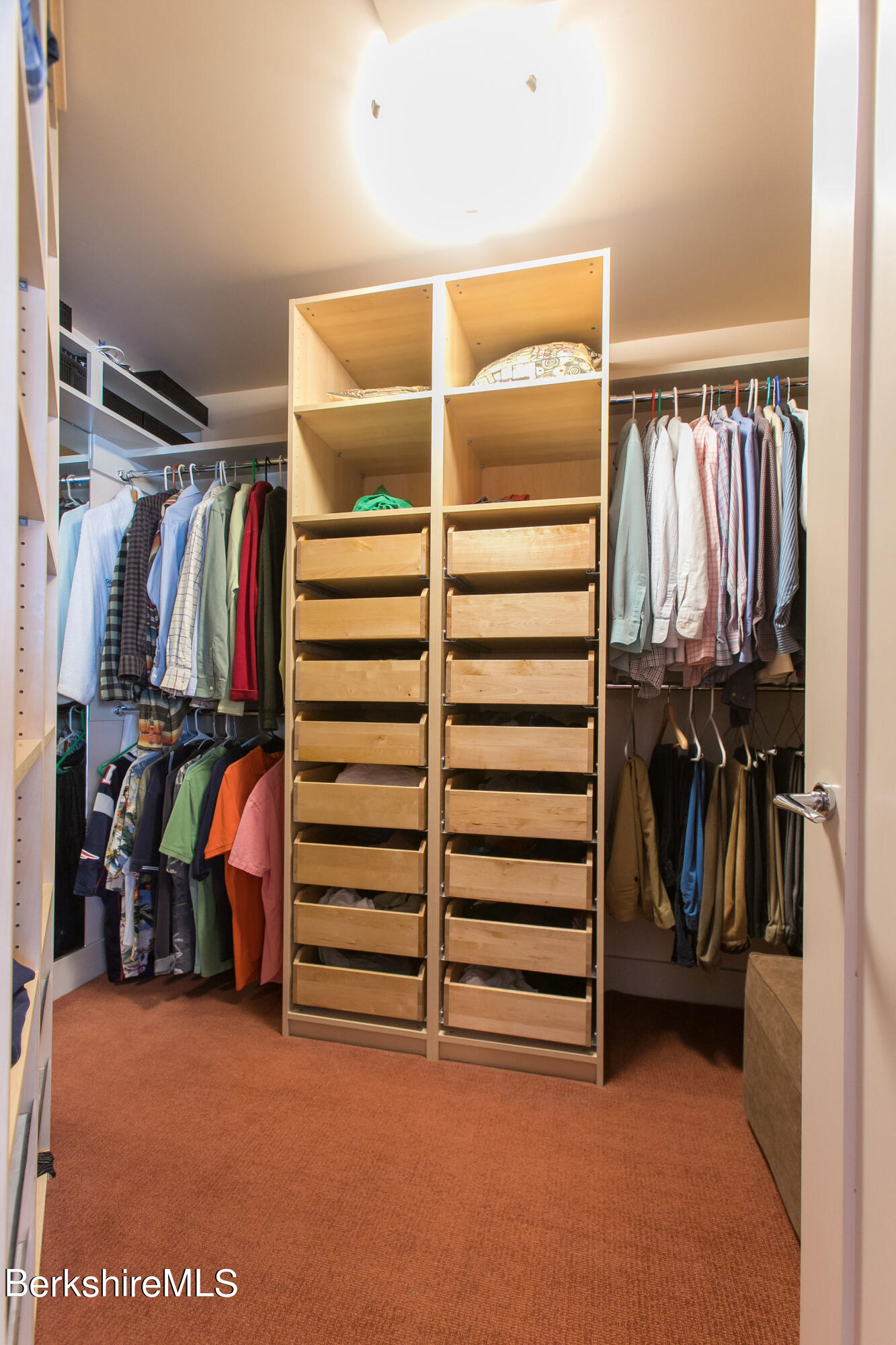 200 Old Stockbridge Road, Unit 3B Lenox, MA 01240 - Photo 17 of 36 a view of walk in closet with clothes and shoes