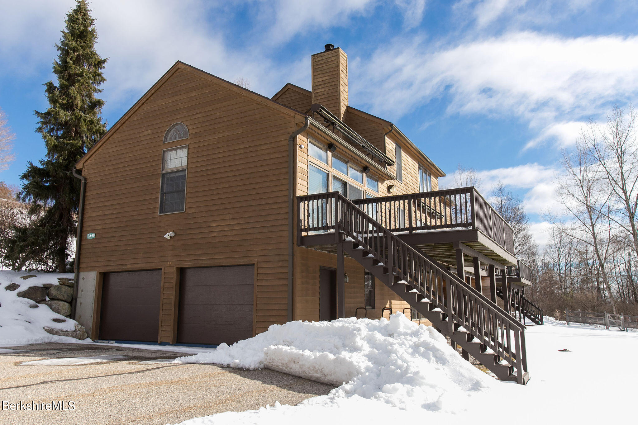 200 Old Stockbridge Road, Unit 3B Lenox, MA 01240 - Photo 31 of 36 a view of a house with a wooden fence