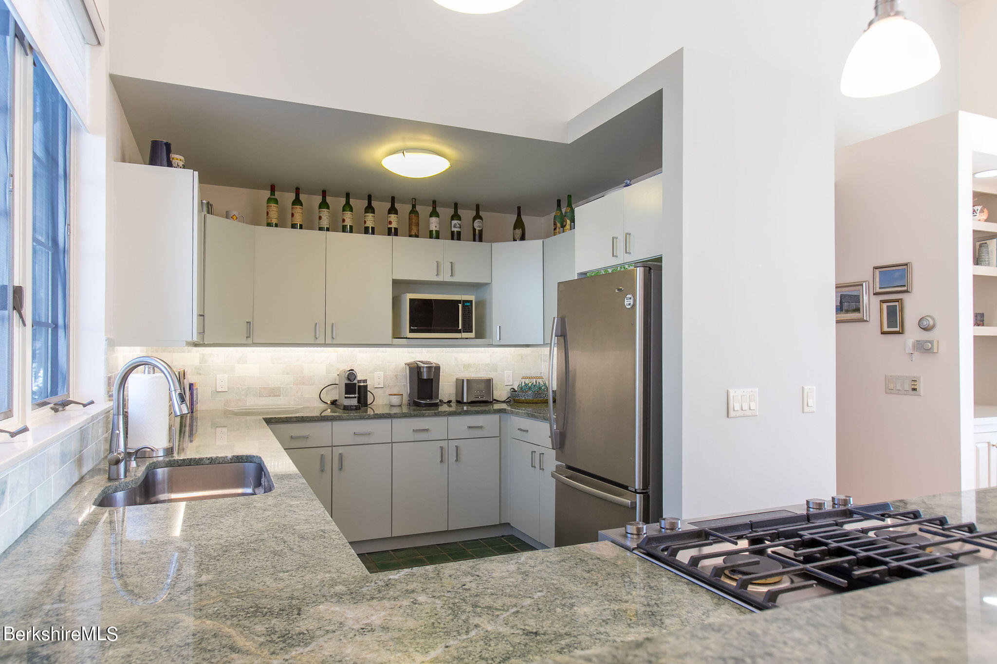 200 Old Stockbridge Road, Unit 3B Lenox, MA 01240 - Photo 8 of 36 a kitchen with stainless steel appliances granite countertop a sink stove and refrigerator