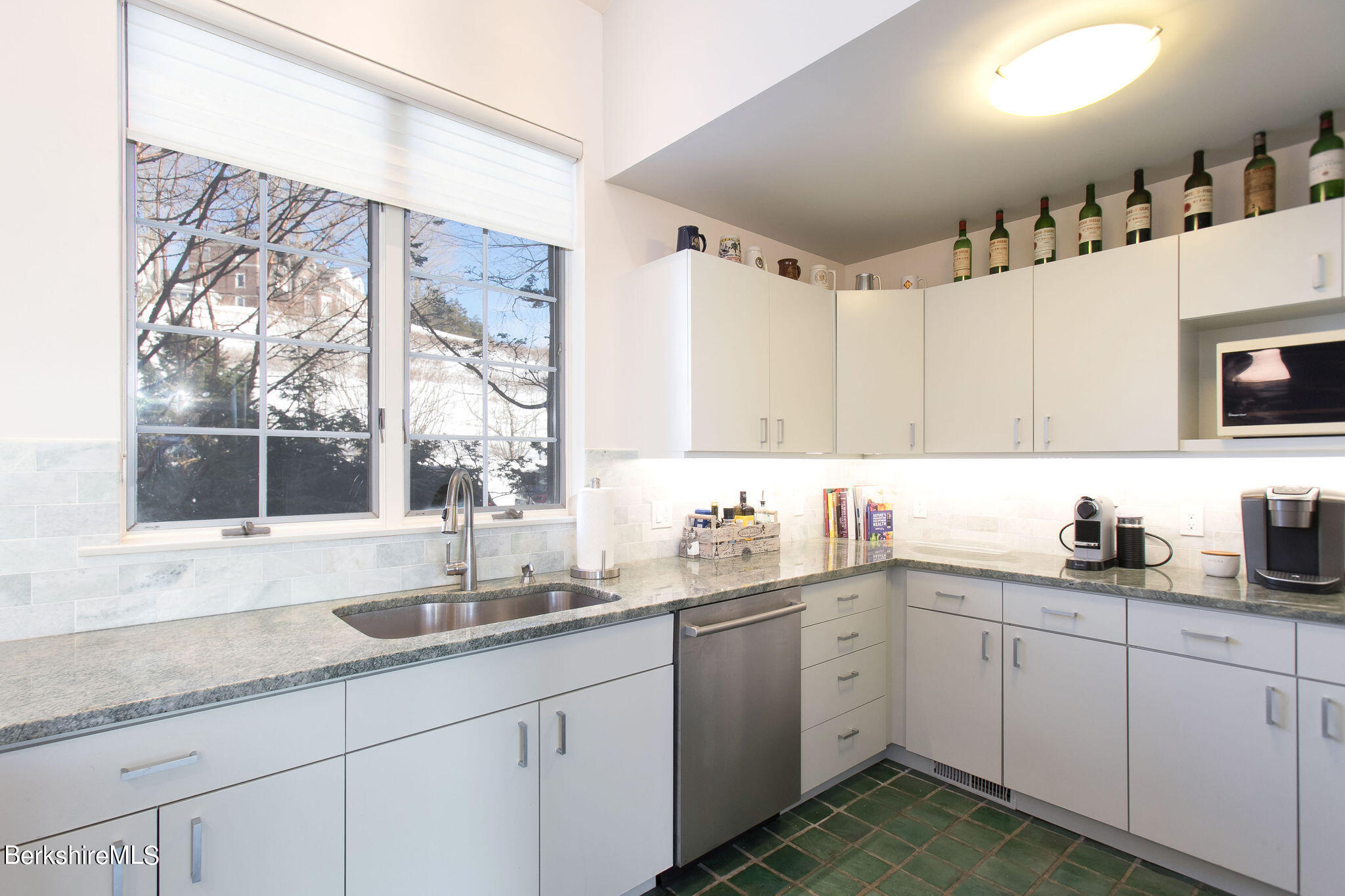 200 Old Stockbridge Road, Unit 3B Lenox, MA 01240 - Photo 9 of 36 a kitchen with sink cabinets and window