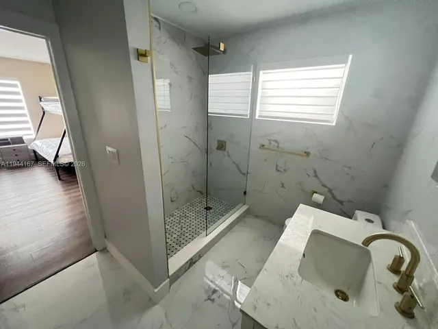 a bathroom with a sink and a shower