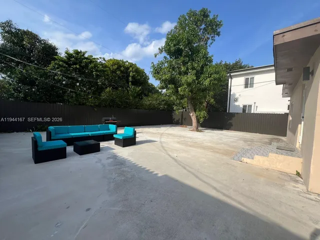 a park view with a bench and trees