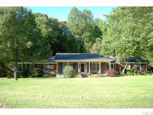 6315 Guess Road Rougemont, NC 27572 - Photo 1 of 12 a front view of a house with a yard