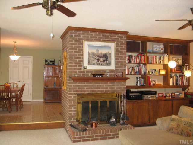 6315 Guess Road Rougemont, NC 27572 - Photo 8 of 12 a living room with furniture and a fireplace