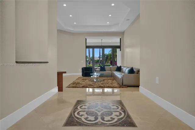 a living room with furniture rug and a table