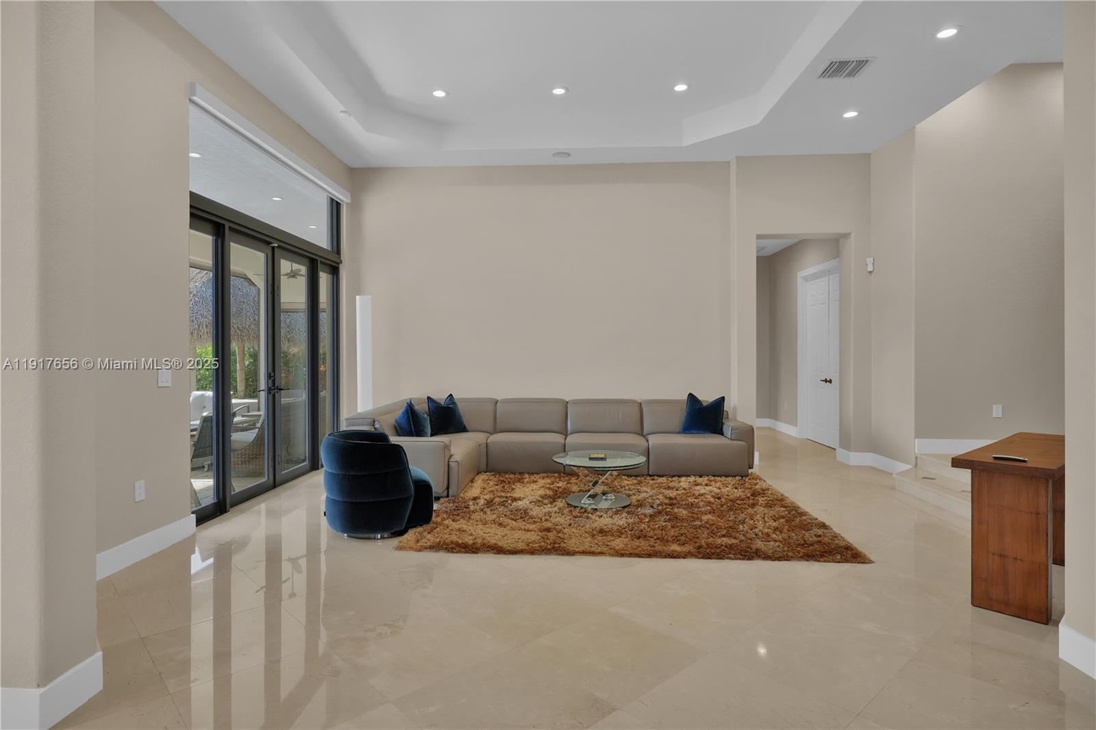 14896 Southwest 38th Street Davie, FL 33331 - Photo 14 of 60 a living room with furniture rug and a table