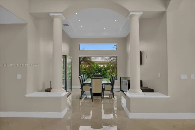 a dining room with furniture a livingroom and outdoor view