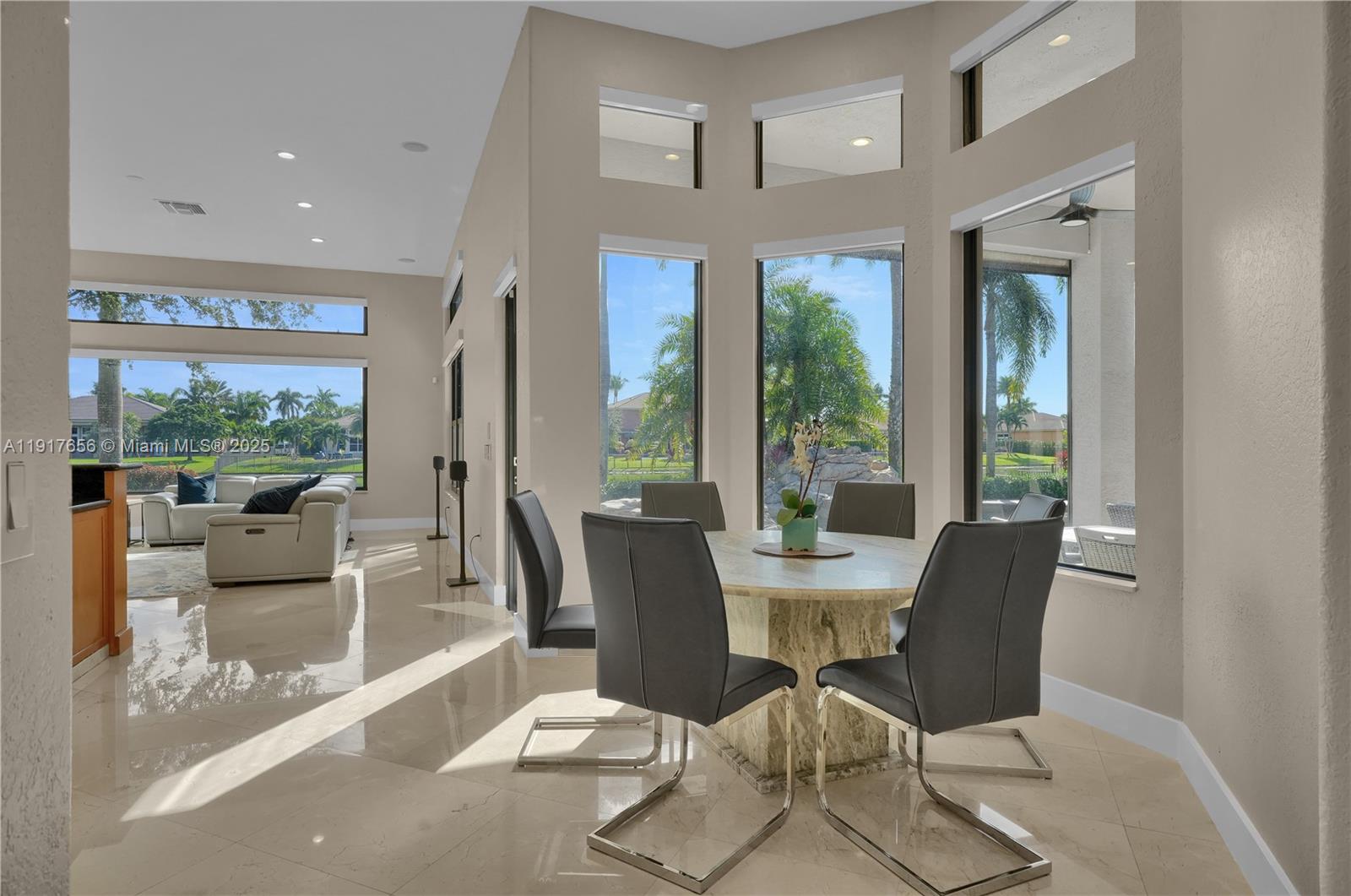 14896 Southwest 38th Street Davie, FL 33331 - Photo 17 of 60 a dining room with furniture a livingroom and outdoor view