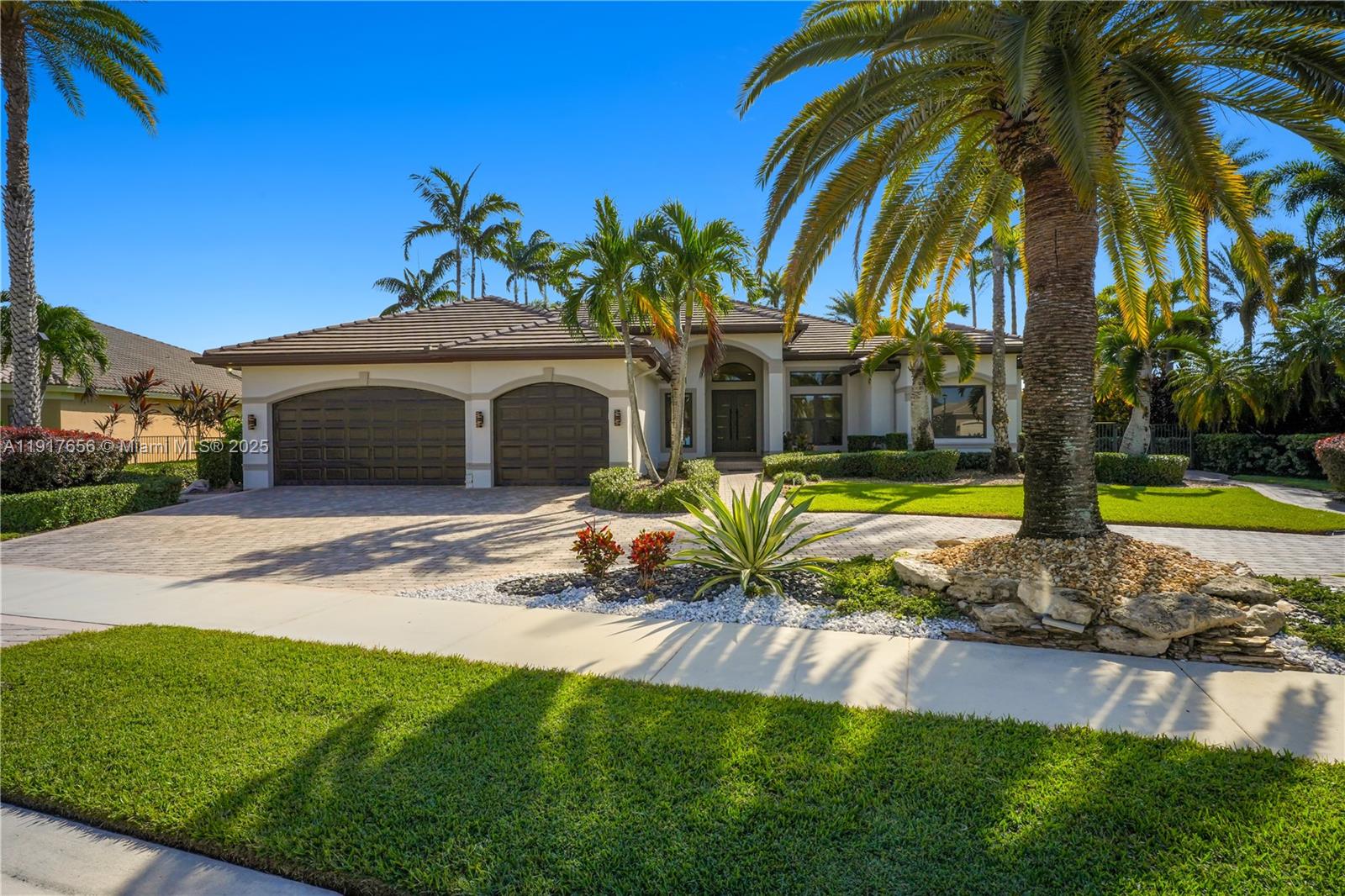 14896 Southwest 38th Street Davie, FL 33331 - Photo 2 of 60 a view of a house with swimming pool and a yard
