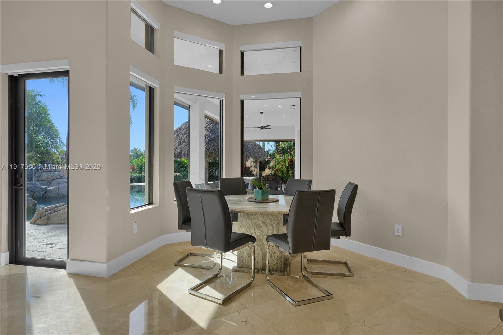 14896 Southwest 38th Street Davie, FL 33331 - Photo 21 of 60 a view of a dining room with furniture and wooden floor
