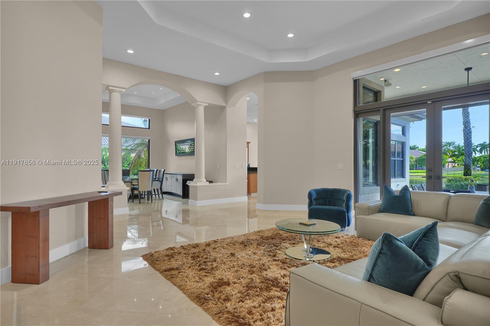 14896 Southwest 38th Street Davie, FL 33331 - Photo 26 of 60 a living room with furniture and a table