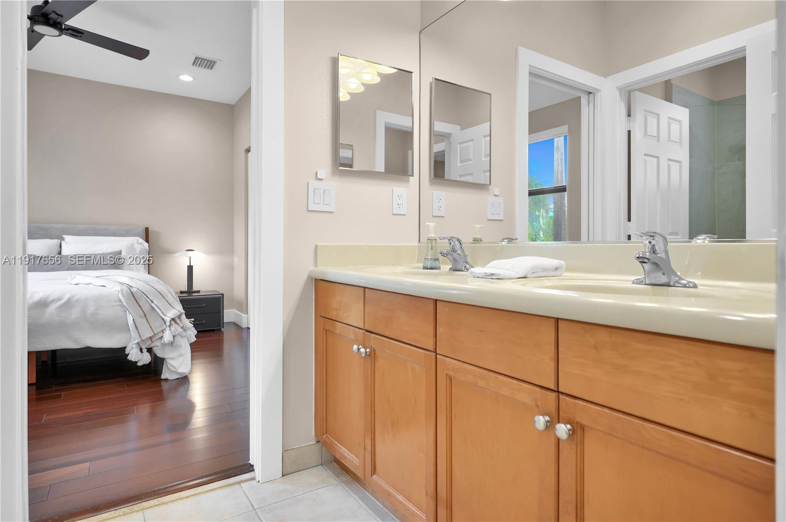 14896 Southwest 38th Street Davie, FL 33331 - Photo 29 of 60 a en suite bathroom with a sink and mirror